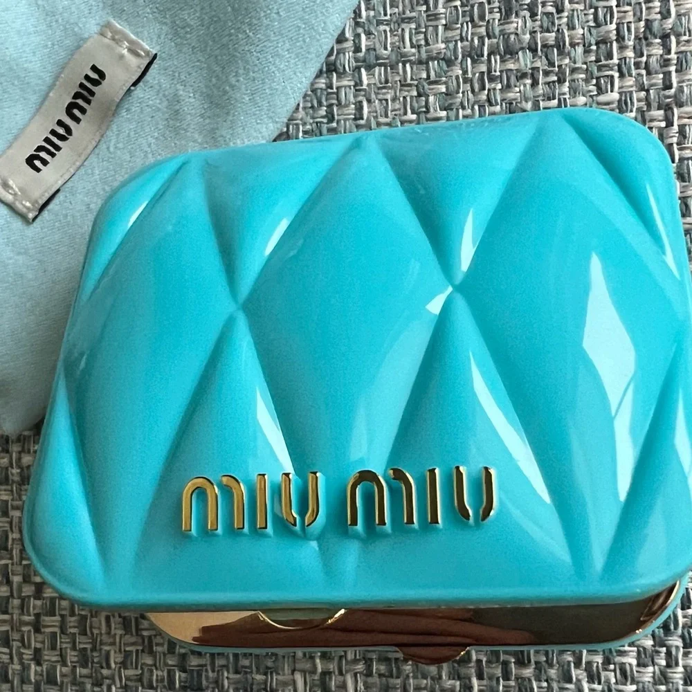39. Miu Miu Turquoise Compact Case